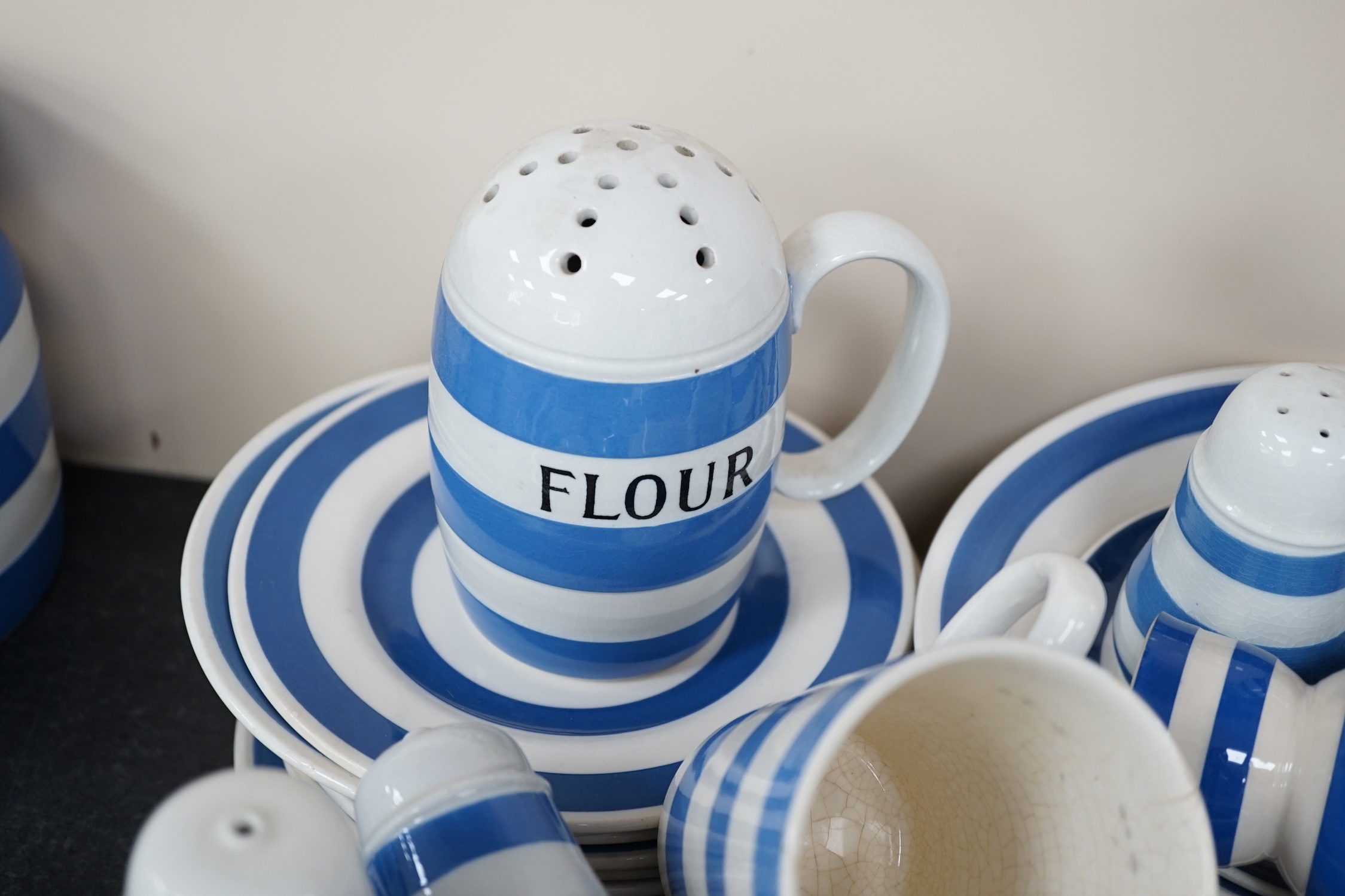 A quantity of unmarked and non T.G.Green blue and white Cornishware to include a Mincemeat jar and cover, egg cups, bowls, dishes and sifters, approximately eighty pieces. Condition - fair to good